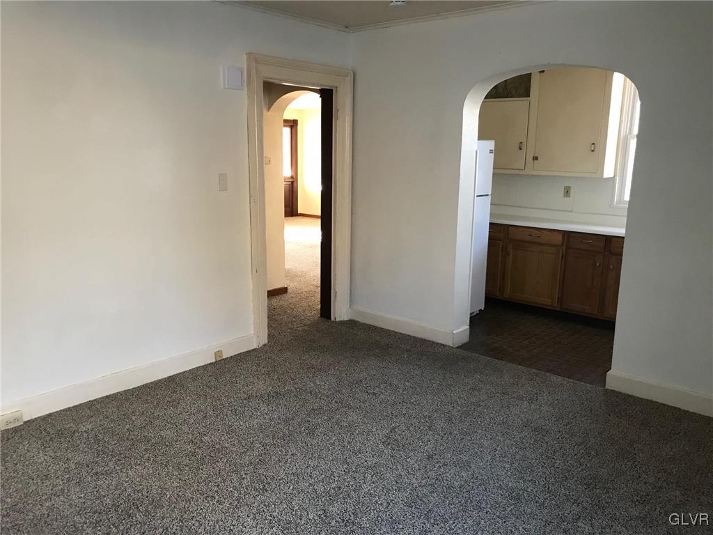 306 1st Street, Unit 1 Slatington, PA 18080 - Photo 4 of 11 an empty room with windows
