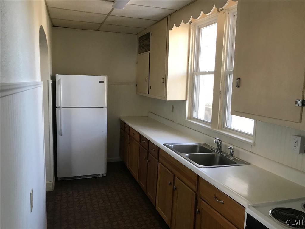 306 1st Street, Unit 1 Slatington, PA 18080 - Photo 5 of 11 a kitchen with a refrigerator and a sink