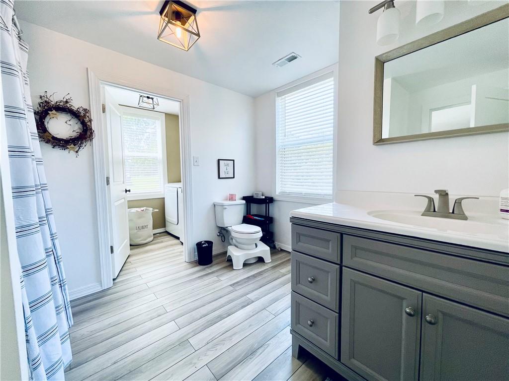 369 Vanderbilt Road Connellsville, PA 15425 - Photo 14 of 25 a spacious bathroom with a double vanity sink and a mirror