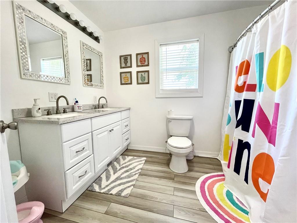 369 Vanderbilt Road Connellsville, PA 15425 - Photo 22 of 25 a bathroom with a toilet sink and mirror