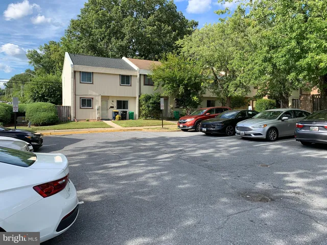 a view of street with parked cars