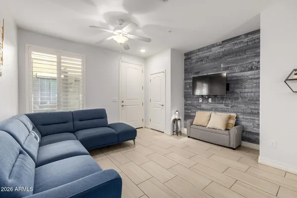 a living room with furniture and a fireplace