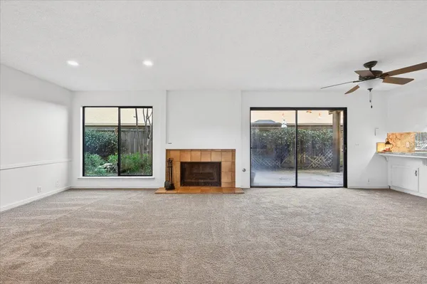 a view of an empty room with glass door