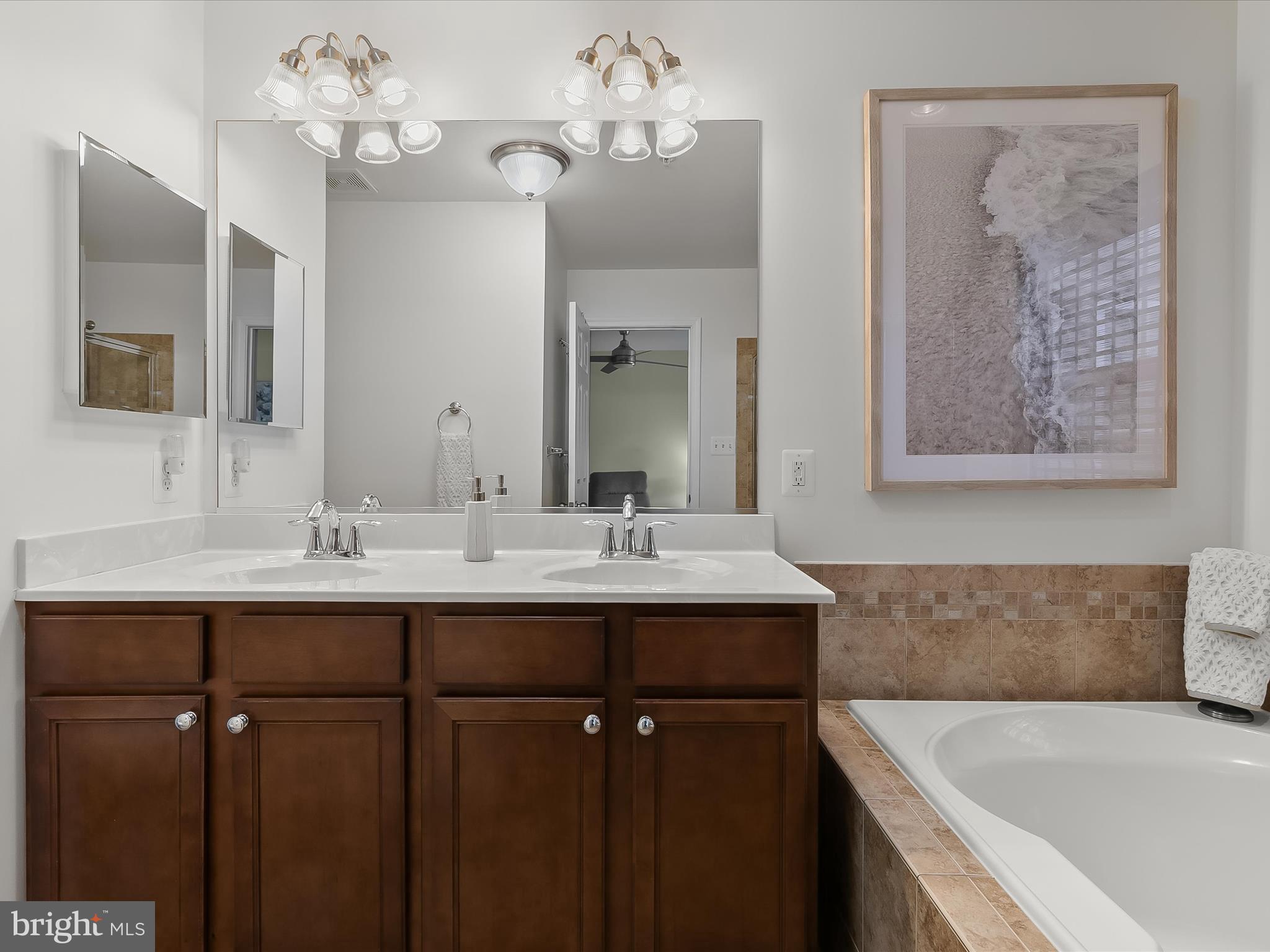 1410 Wellspring Drive Aberdeen, MD 21001 - Photo 29 of 55 a bathroom with a double vanity sink and a mirror