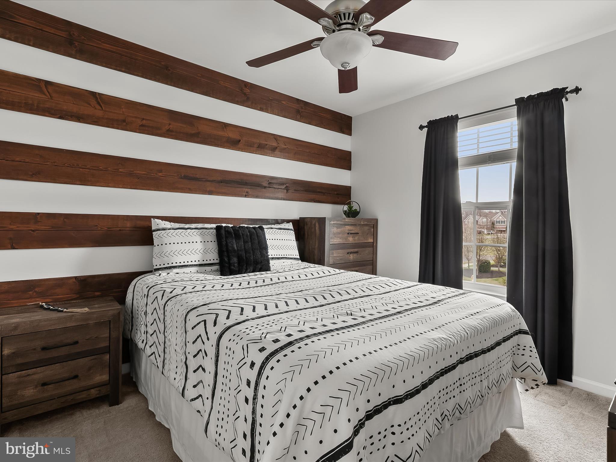 1410 Wellspring Drive Aberdeen, MD 21001 - Photo 30 of 55 a bedroom with a bed and a chandelier