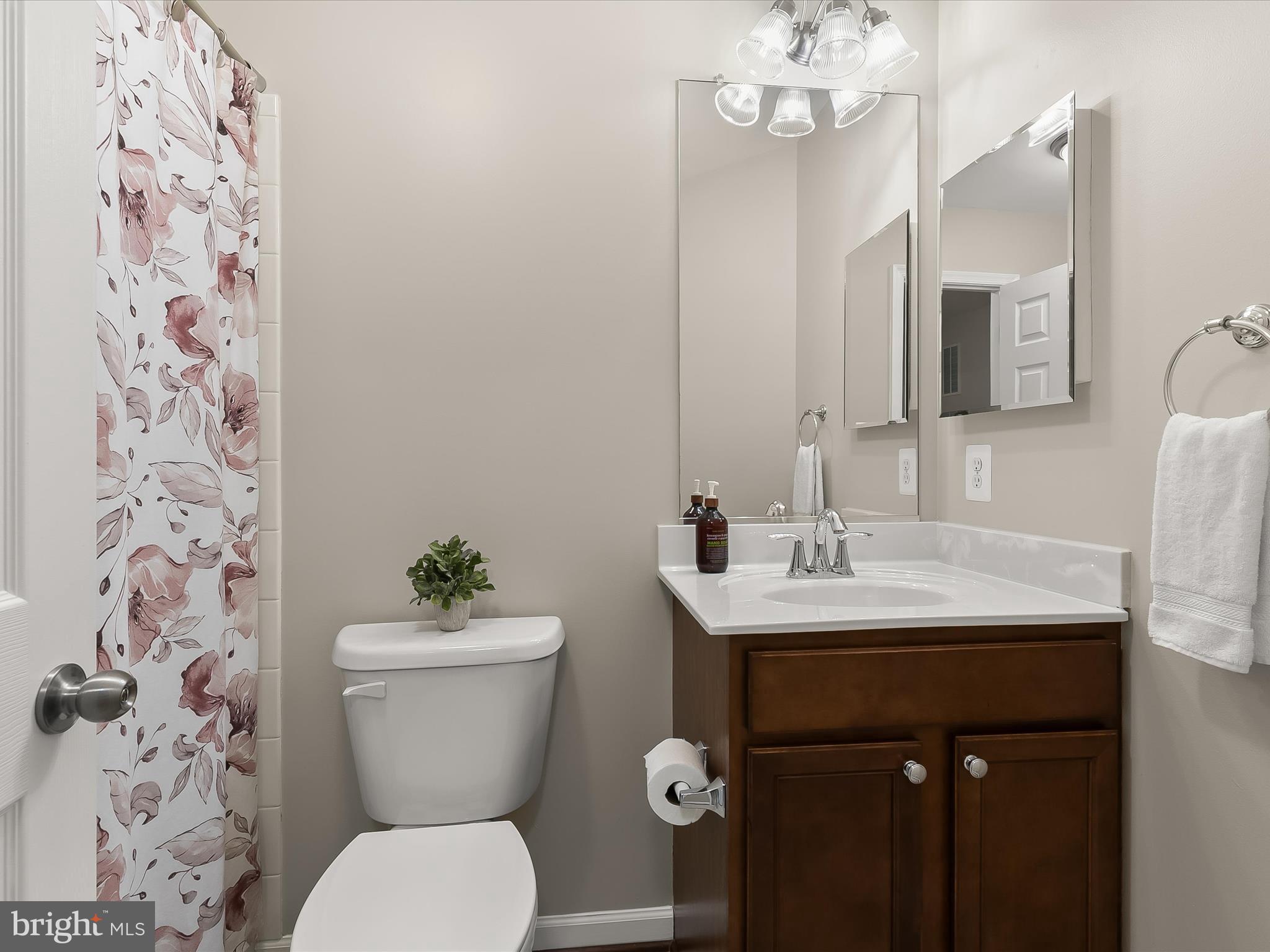 1410 Wellspring Drive Aberdeen, MD 21001 - Photo 34 of 55 a bathroom with a sink mirror vanity and toilet