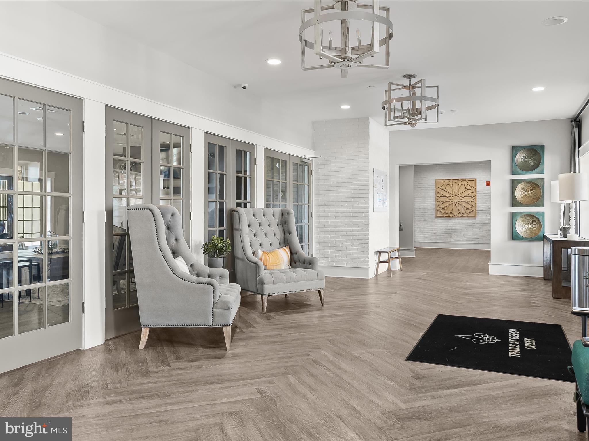 1410 Wellspring Drive Aberdeen, MD 21001 - Photo 41 of 55 a living room with furniture and a chandelier