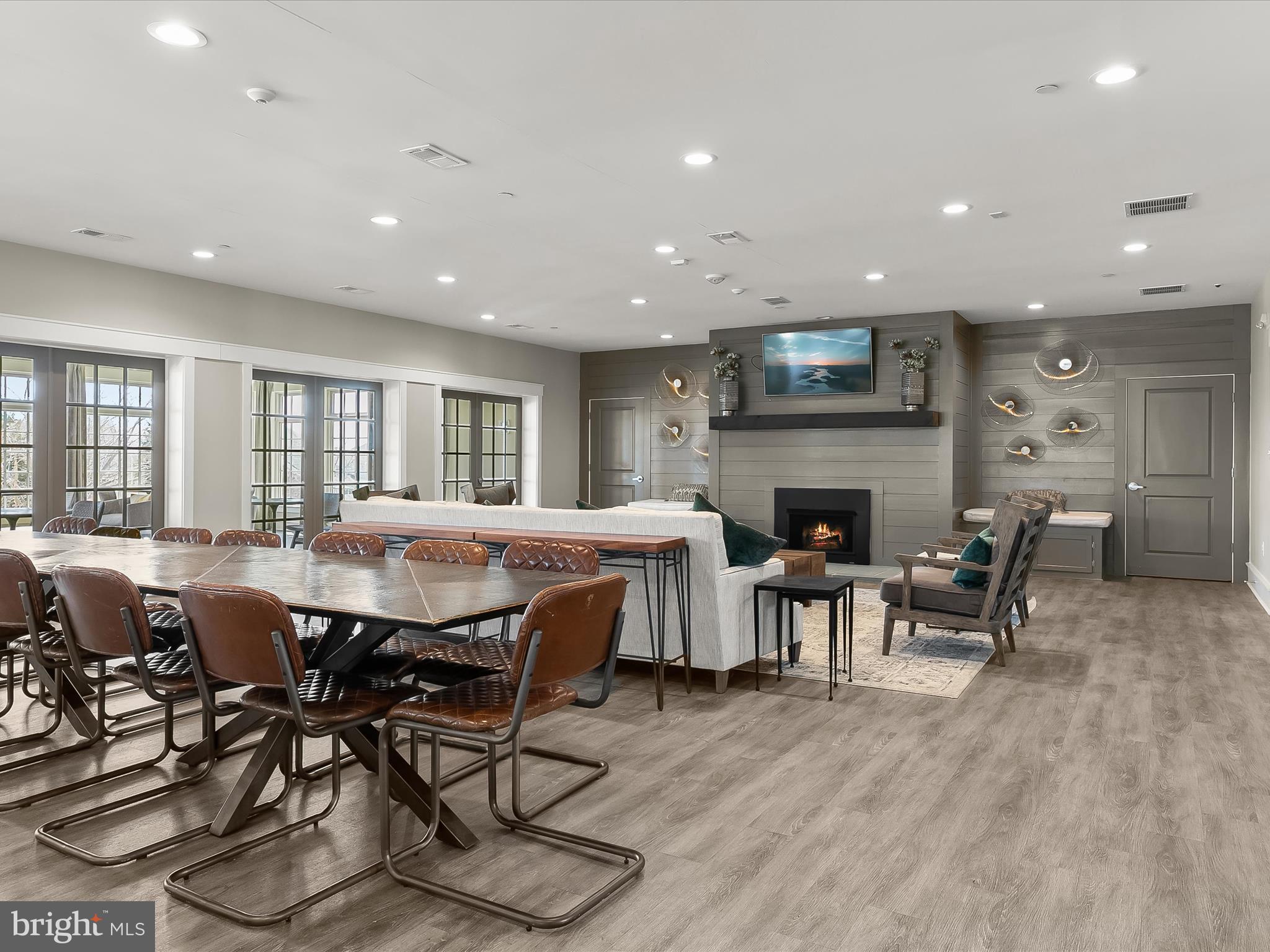 1410 Wellspring Drive Aberdeen, MD 21001 - Photo 42 of 55 a view of a dining room with furniture a fireplace and wooden floor