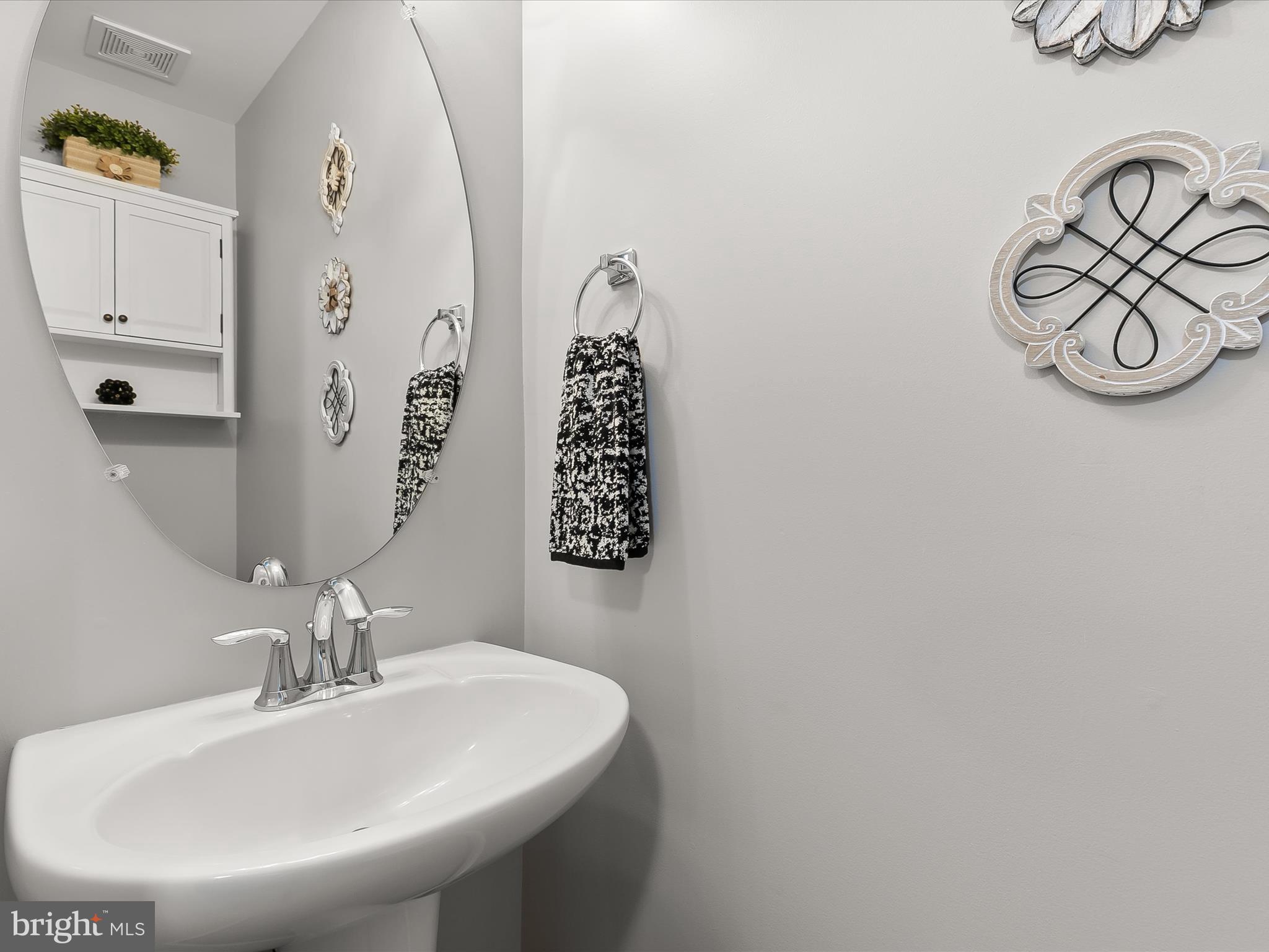 1410 Wellspring Drive Aberdeen, MD 21001 - Photo 5 of 55 a bathroom with a sink and a mirror