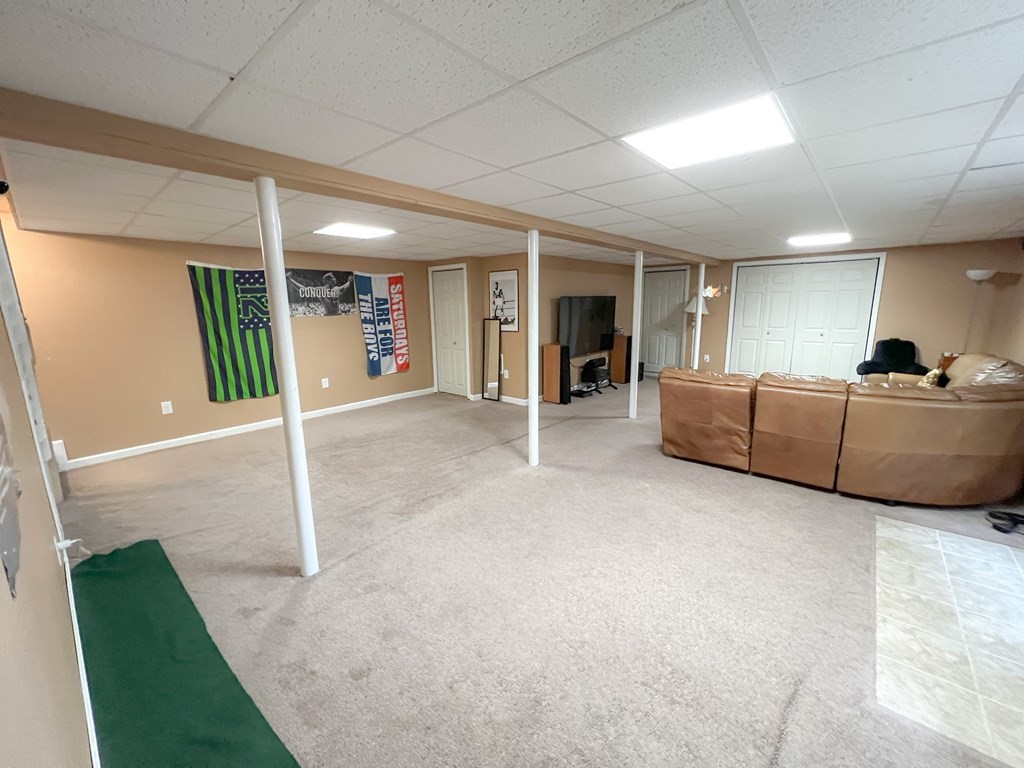 35 Robert Road Tyngsborough, MA 01879 - Photo 12 of 25 a living room with furniture and a window