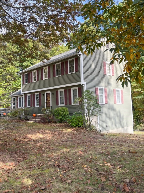 35 Robert Road Tyngsborough, MA 01879 - Photo 2 of 25 a front view of a house with a yard