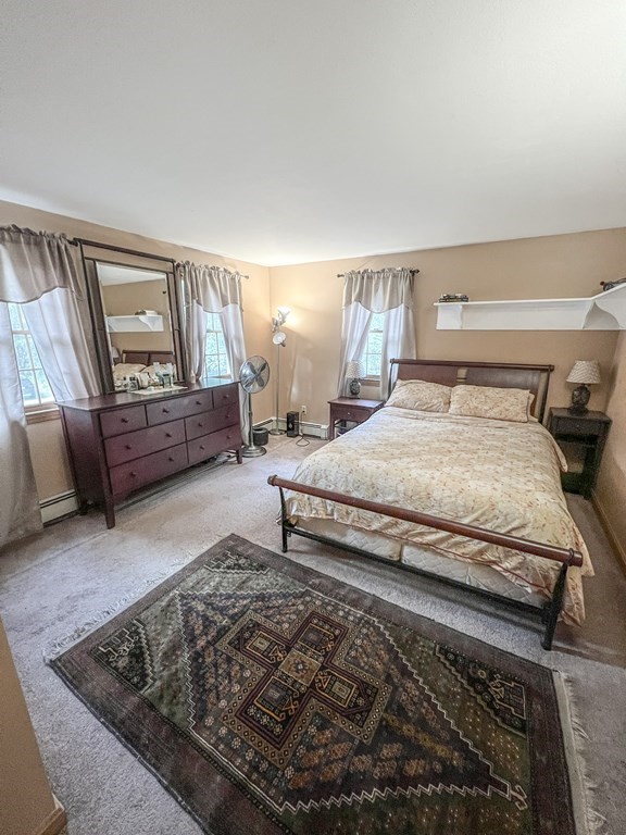 35 Robert Road Tyngsborough, MA 01879 - Photo 22 of 25 a bedroom with a bed and window