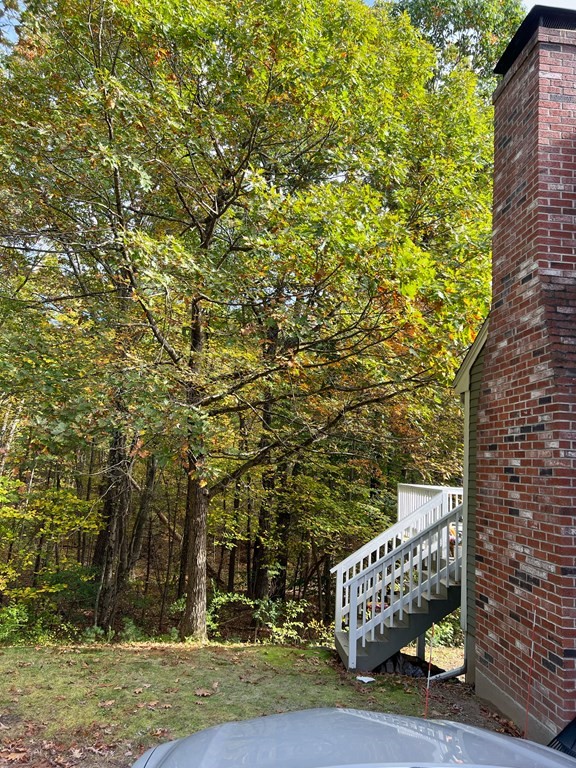 35 Robert Road Tyngsborough, MA 01879 - Photo 4 of 25 a front view of a house with a yard