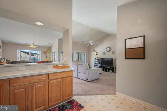 a kitchen with cabinets a sink and appliances