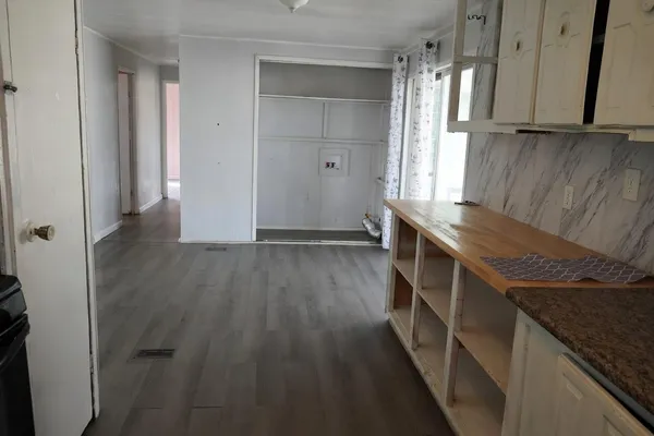 a kitchen with wooden cabinets and a sink