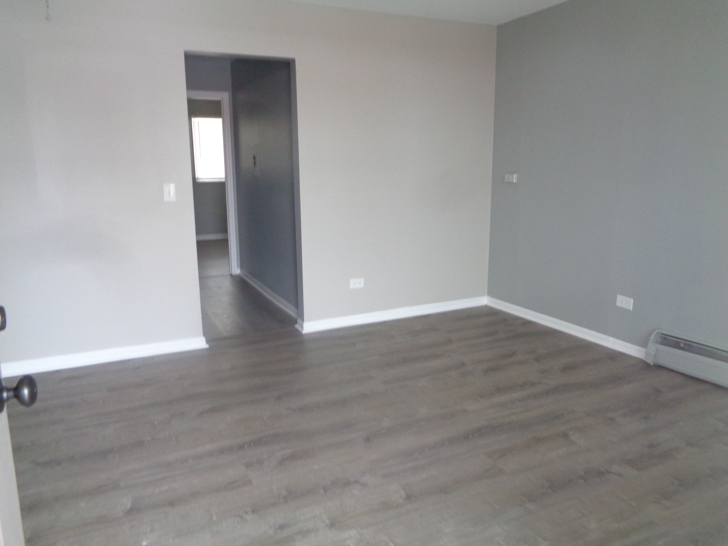 1340 North Main Street, Unit A17 Wheaton, IL 60187 - Photo 6 of 7 a view of an empty room with wooden floor & closet