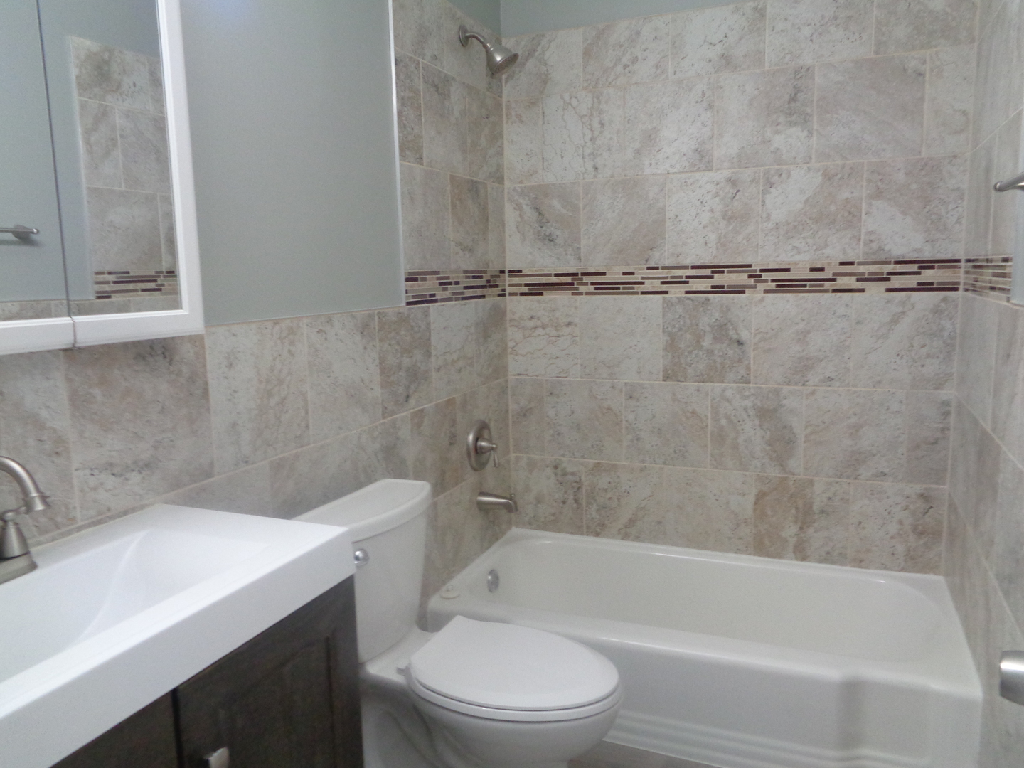 1340 North Main Street, Unit A17 Wheaton, IL 60187 - Photo 7 of 7 a bathroom with a sink a toilet and a bathtub