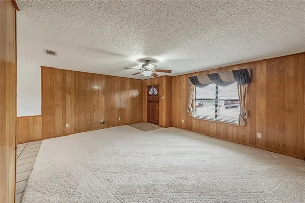 a open kitchen with granite countertop a sink dishwasher stove top oven and cabinets