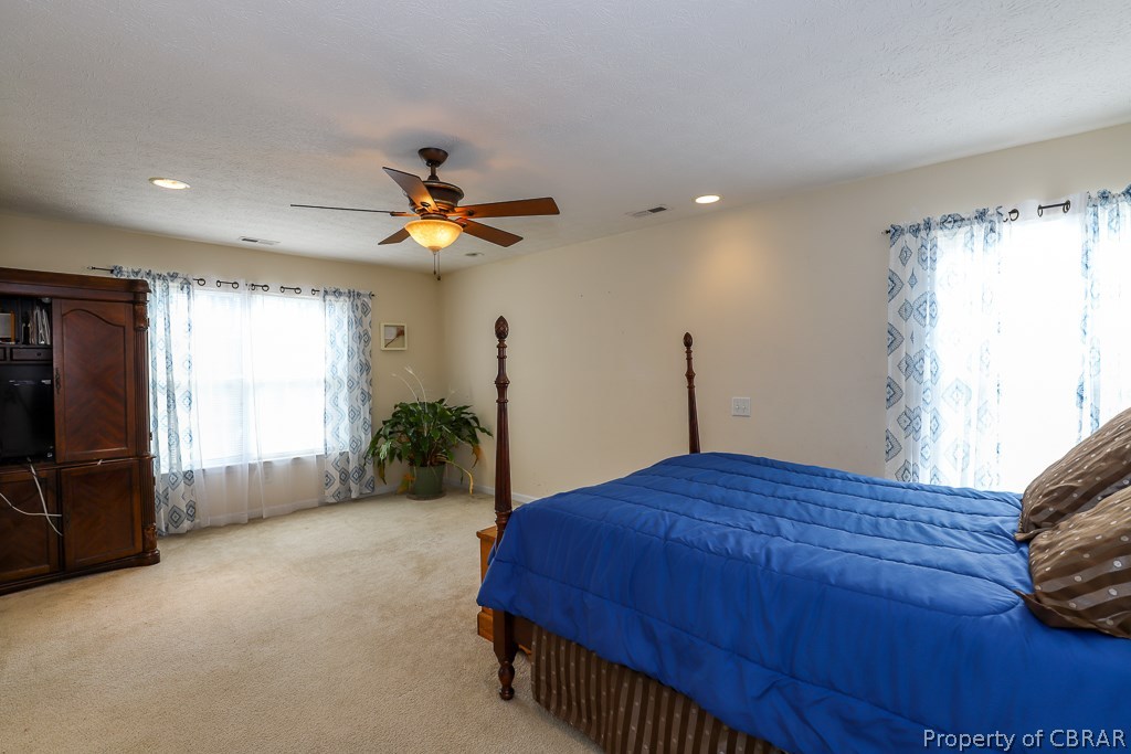 7211 Woody Road Gloucester, VA 23061 - Photo 12 of 24 Master bedroom with walk in closet and master ensuite to include garden tub and stand up shower!