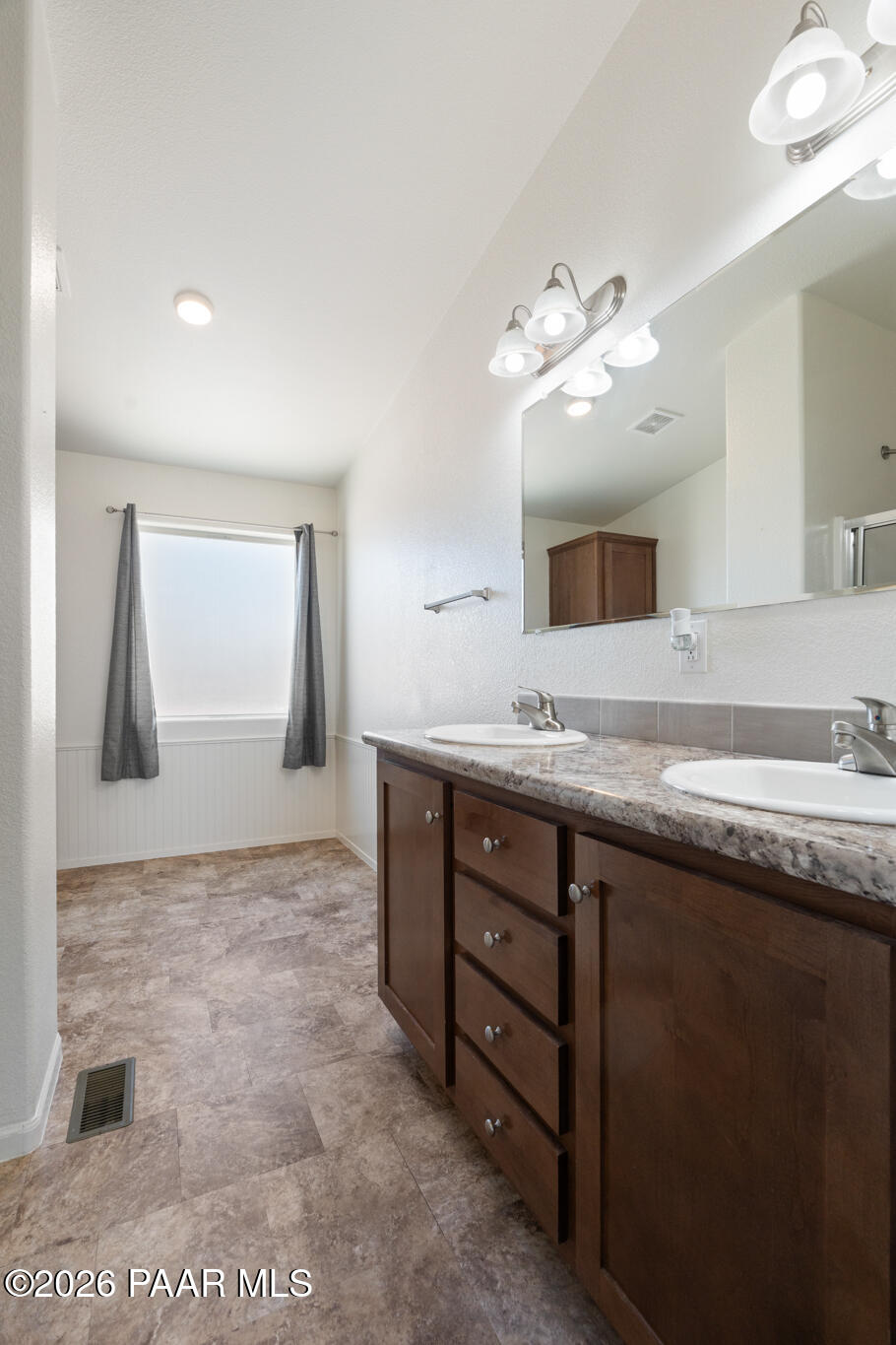 575 Ranch House Road Paulden, AZ 86334 - Photo 14 of 36 a bathroom with a granite countertop sink a large mirror and a