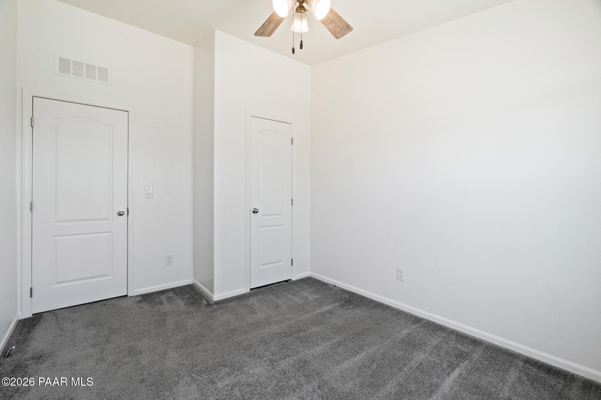 575 Ranch House Road Paulden, AZ 86334 - Photo 18 of 36 an empty room with a chandelier fan
