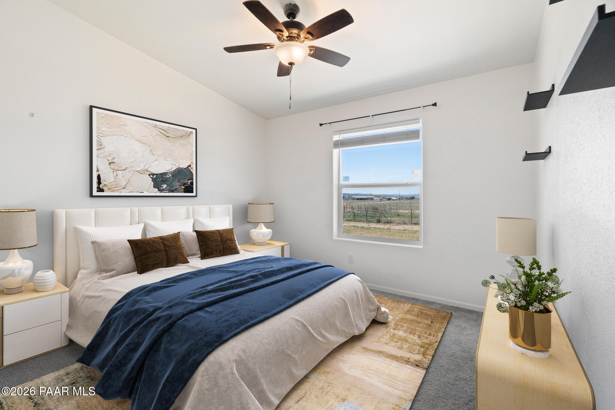 575 Ranch House Road Paulden, AZ 86334 - Photo 21 of 36 a bedroom with a large bed and a chandelier