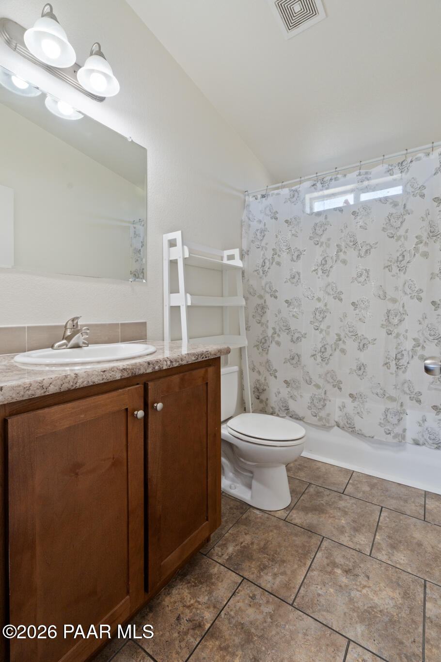 575 Ranch House Road Paulden, AZ 86334 - Photo 23 of 36 a bathroom with a granite countertop toilet sink and mirror