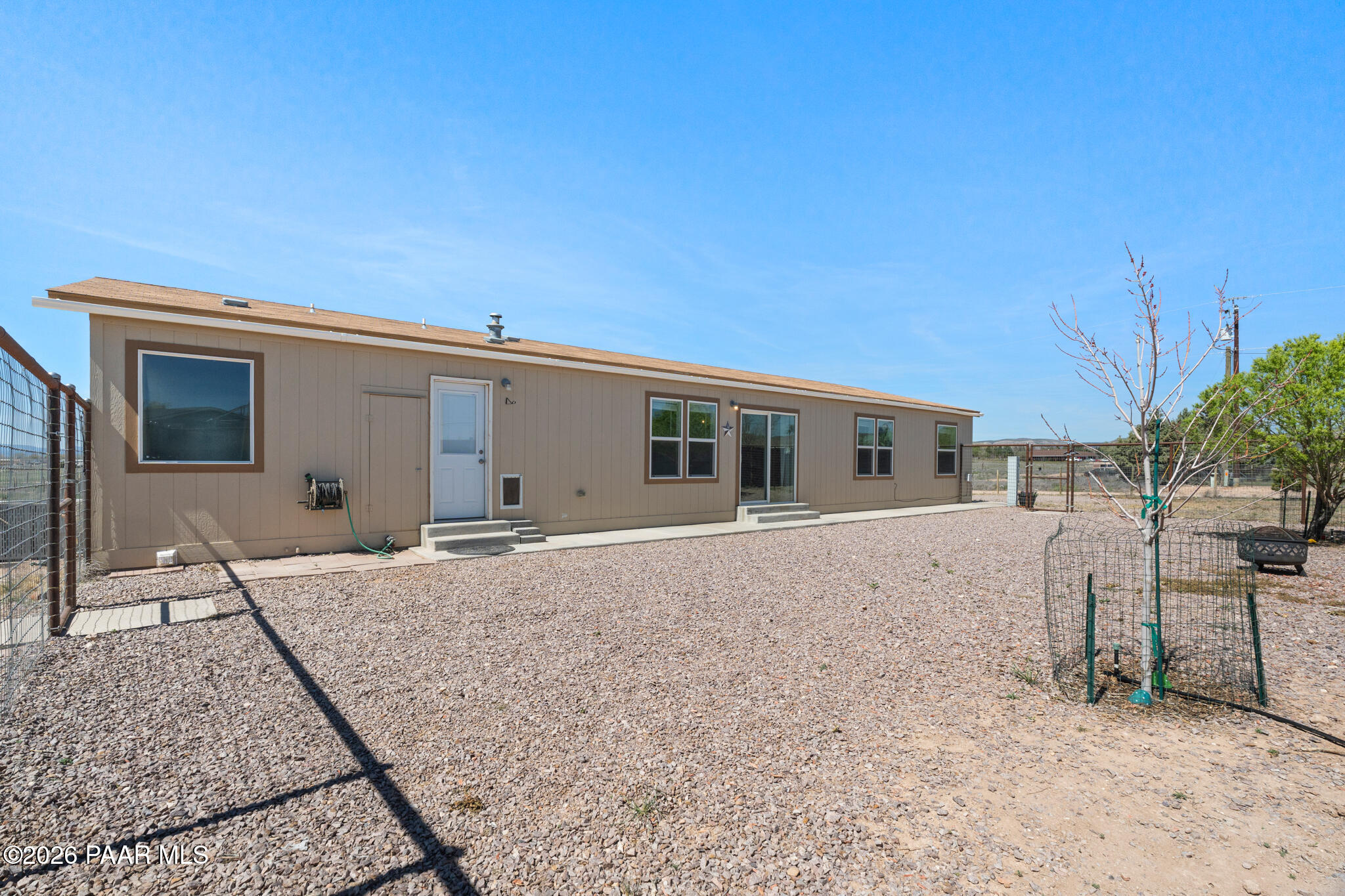 575 Ranch House Road Paulden, AZ 86334 - Photo 26 of 36 a front view of a house with a yard