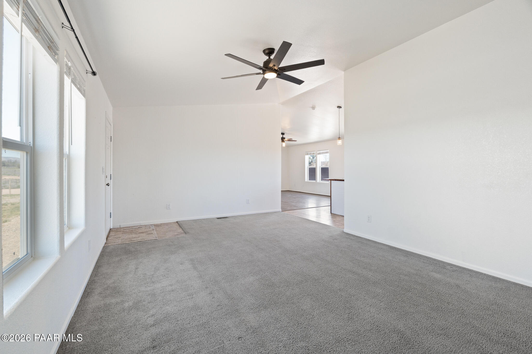 575 Ranch House Road Paulden, AZ 86334 - Photo 4 of 36 a view of empty room with a ceiling fan and window