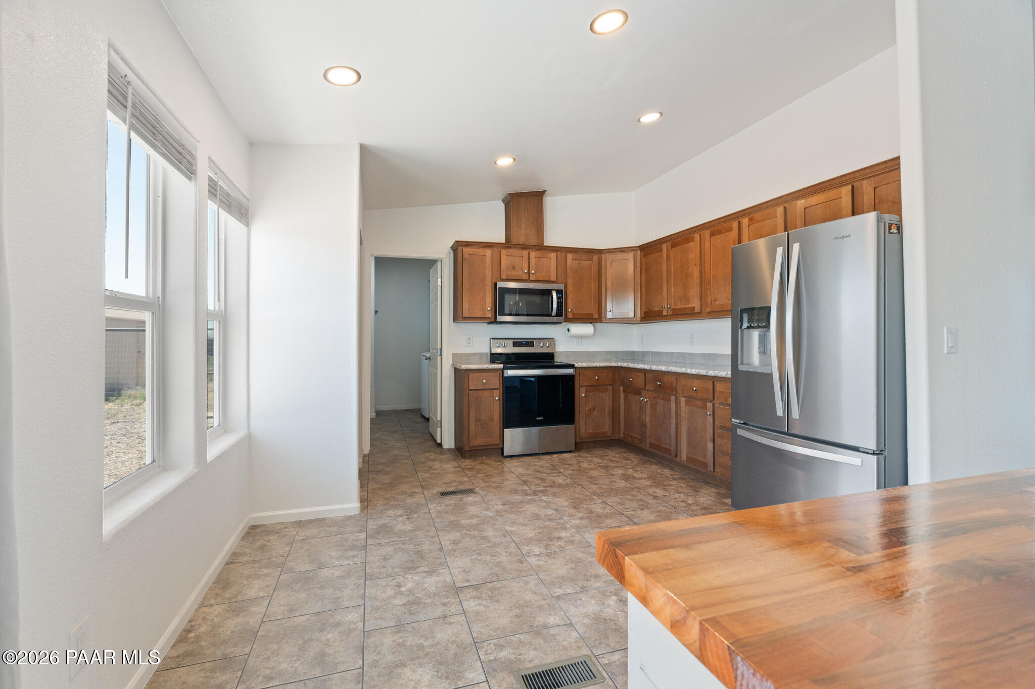 575 Ranch House Road Paulden, AZ 86334 - Photo 5 of 36 a kitchen with granite countertop a refrigerator and a sink