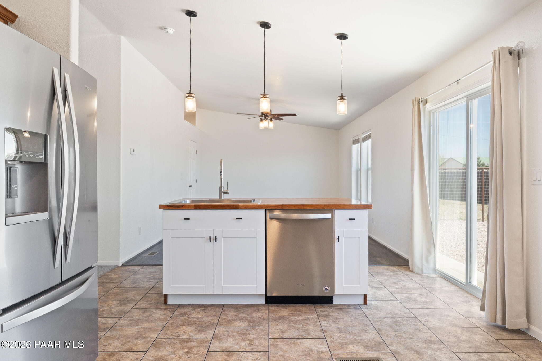 575 Ranch House Road Paulden, AZ 86334 - Photo 8 of 36 a view of cabinets and refrigerator