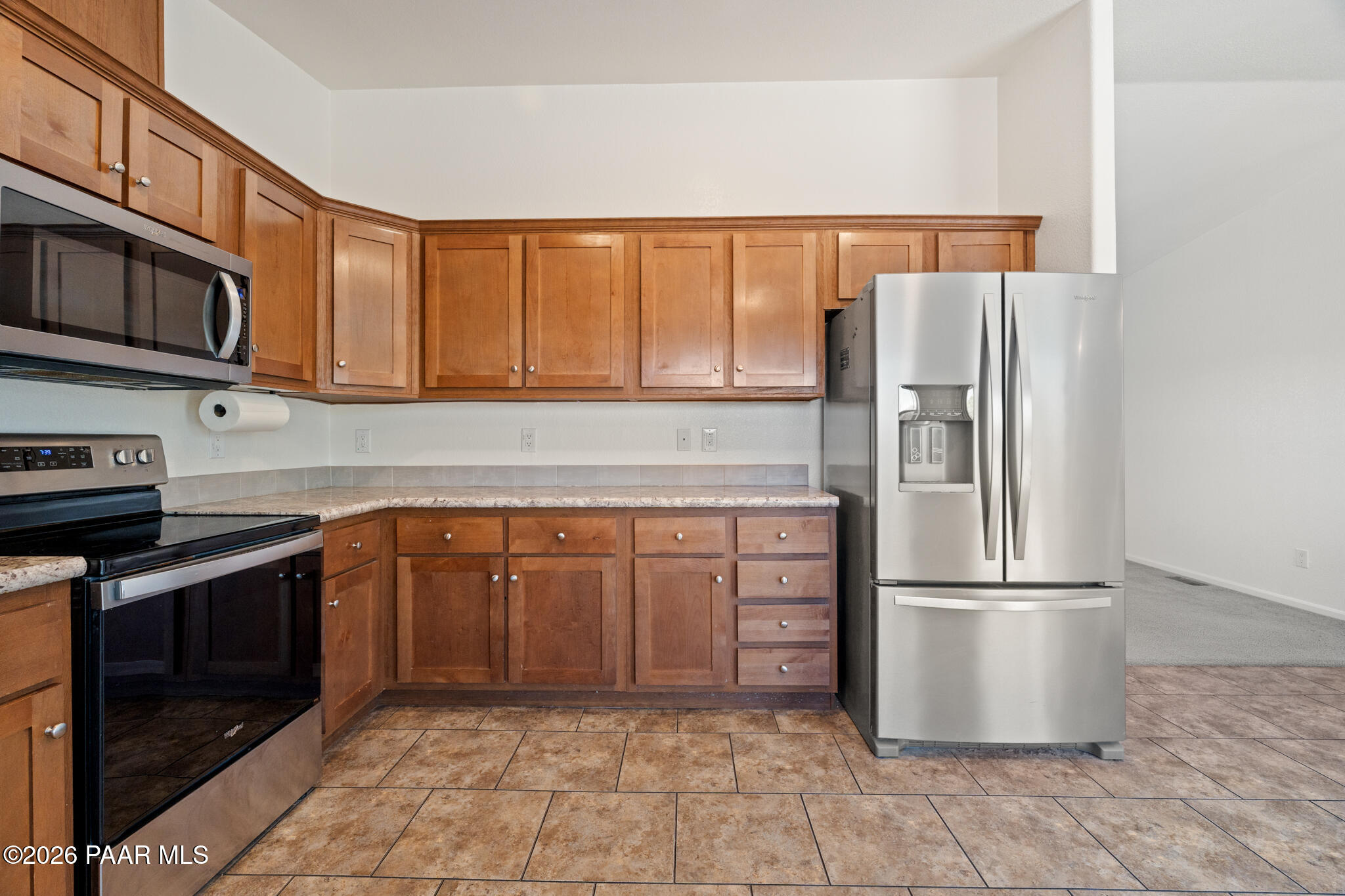575 Ranch House Road Paulden, AZ 86334 - Photo 9 of 36 a kitchen with stainless steel appliances granite countertop a refrigerator stove and sink