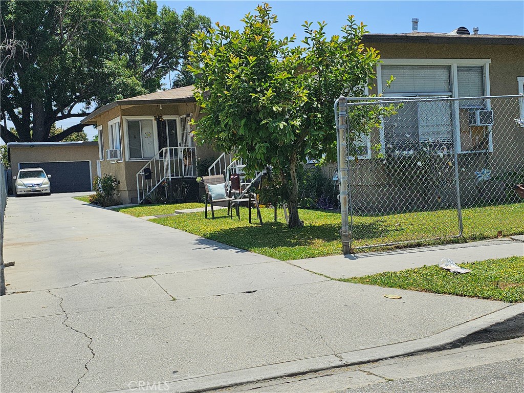 214 East Johnson Street Compton, CA 90220 - Photo 1 of 2 a view of a house with a yard and large tree