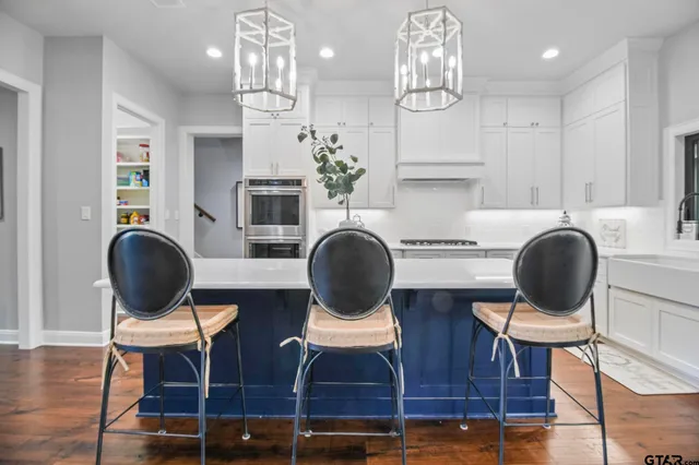 a living room with dining table and chairs