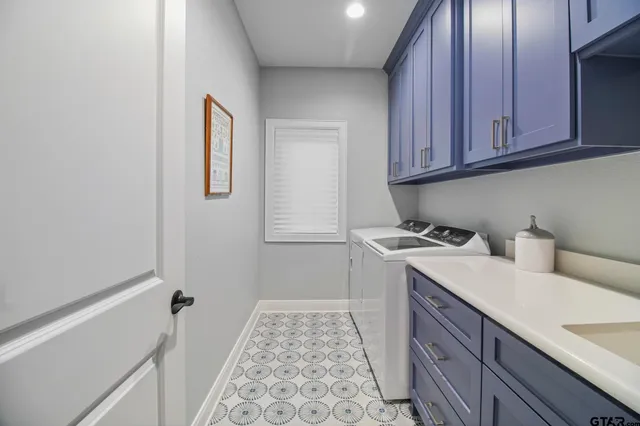 a view of a kitchen with sink and cabinets