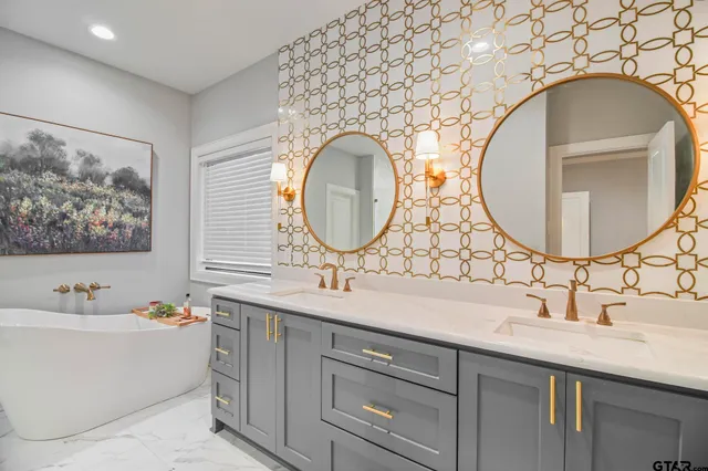 a bathroom with a double vanity sink and a mirror