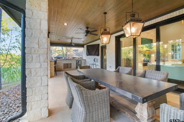 a dining room with wooden floor and outdoor space
