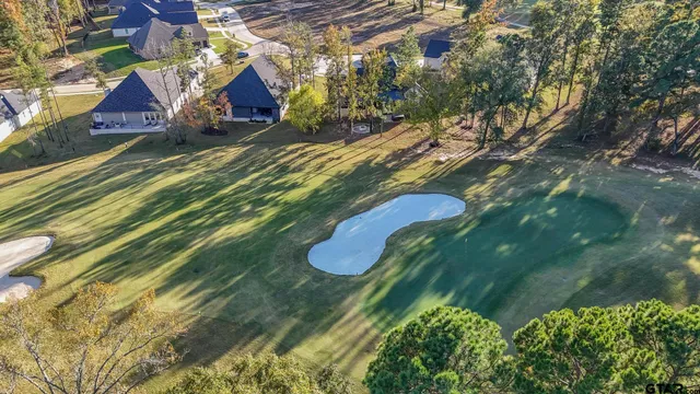 a view of swimming pool with seating space