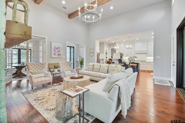 a living room with fireplace furniture and a wooden floor