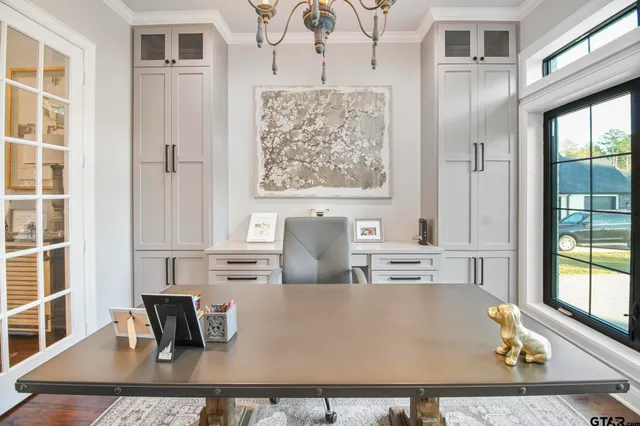 a living room with furniture and next to a window