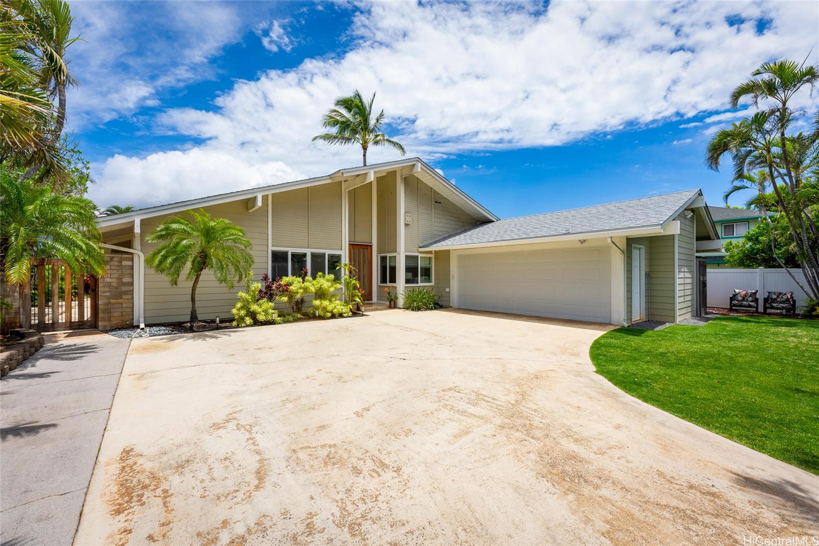 a view of a house with a yard and garage