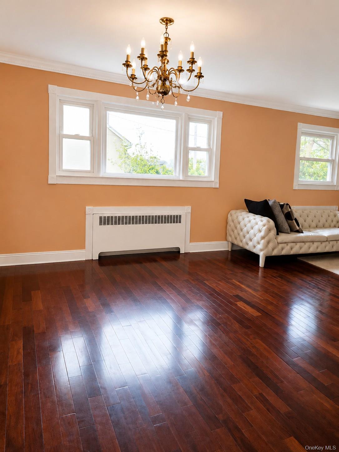 180 Sutton Manor Road New Rochelle, NY 10801 - Photo 4 of 9 a living room with furniture and wooden floor