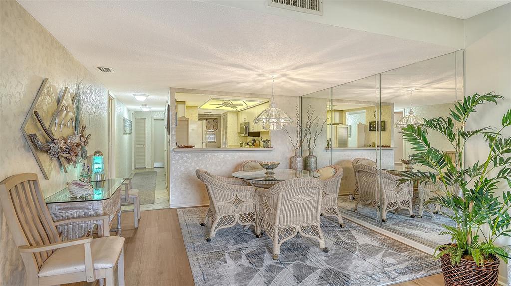 8773 Midnight Pass Road, Unit 102G Sarasota, FL 34242 - Photo 14 of 79 a view of a dining room with furniture