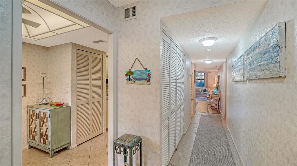 8773 Midnight Pass Road, Unit 102G Sarasota, FL 34242 - Photo 22 of 79 a view of hallway with wooden floor