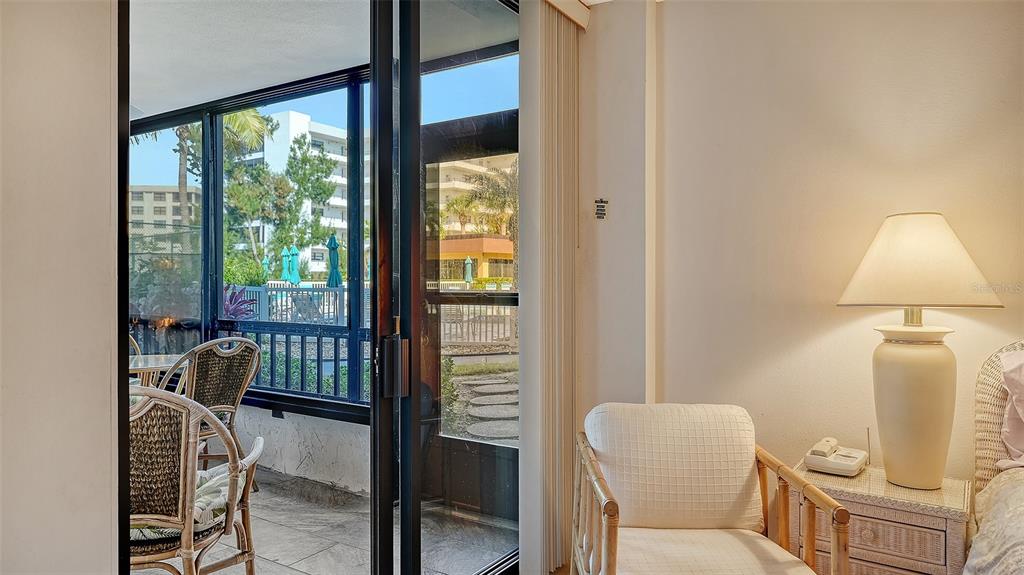 8773 Midnight Pass Road, Unit 102G Sarasota, FL 34242 - Photo 25 of 79 a living room with furniture and a window