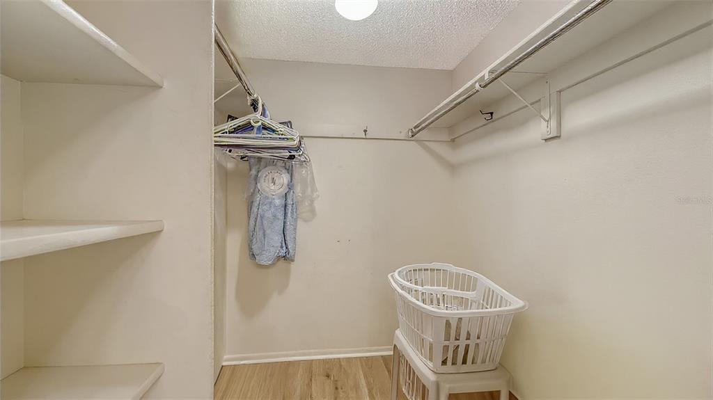 8773 Midnight Pass Road, Unit 102G Sarasota, FL 34242 - Photo 30 of 79 a view of a door and chair in a room