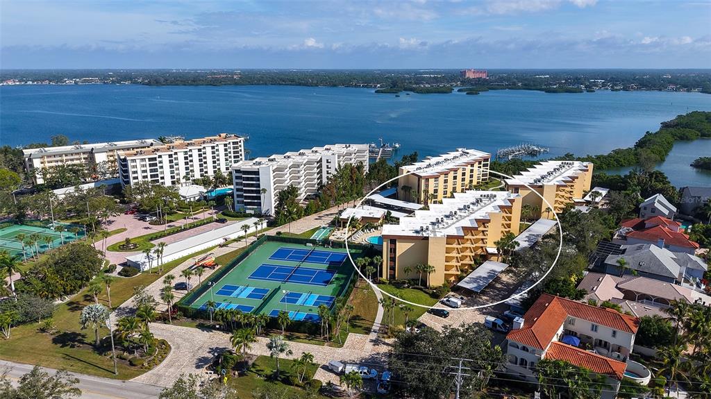 8773 Midnight Pass Road, Unit 102G Sarasota, FL 34242 - Photo 3 of 79 a view of a lake with a mountain view