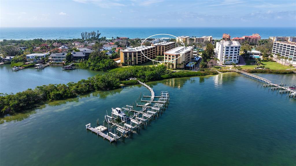 8773 Midnight Pass Road, Unit 102G Sarasota, FL 34242 - Photo 36 of 79 an aerial view of a house with outdoor space swimming pool and ocean view