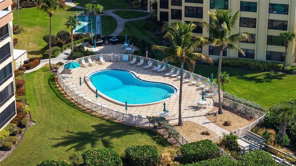8773 Midnight Pass Road, Unit 102G Sarasota, FL 34242 - Photo 43 of 79 an aerial view of a house with swimming pool garden and patio