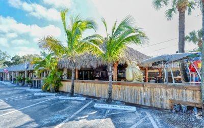 8773 Midnight Pass Road, Unit 102G Sarasota, FL 34242 - Photo 79 of 79 a view of a house with a yard and mountain view